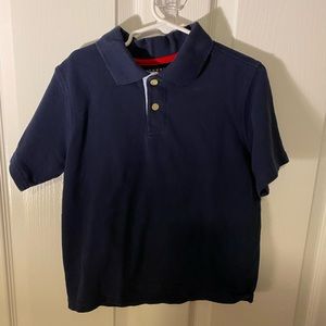 Tommy navy blue polo. Great for school uniform.